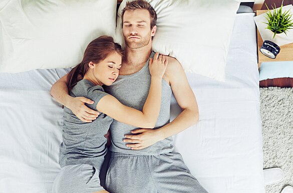 Young couple sleeping in embrace