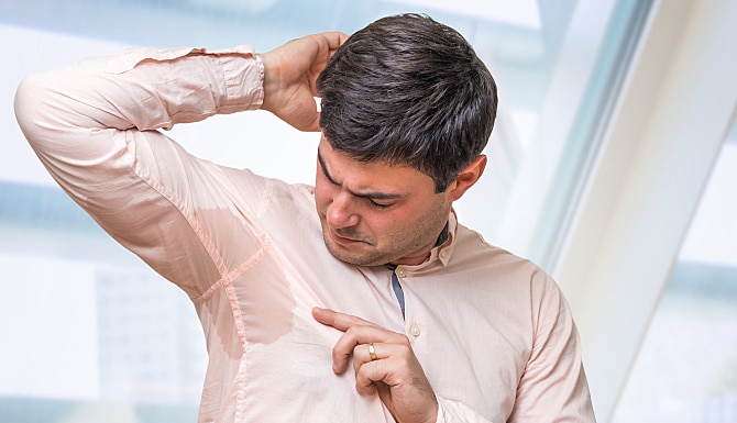 Business Man With Sweating Under Armpit In Office Business Man With Sweating Under Armpit In Office