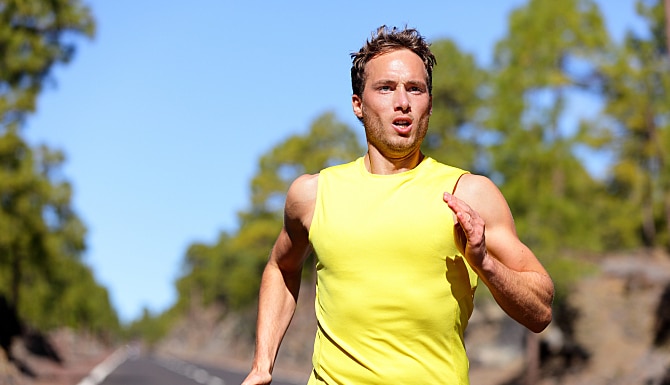 Running man sprinting for success on run. Male athlete runner training at fast speed. Muscular fit s Running man sprinting for success on run. Male athlete runner training at fast speed. Muscular fit s